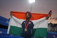 | Photo: AP/Thibault Camus : Paris Paralympics 2024 Para archery: Harvinder Singh of India celebrates after winning the gold medal in the men's Individual Recurve Open